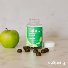 Mom holding a Milkflow Moringa Gummy as part of daily routine
