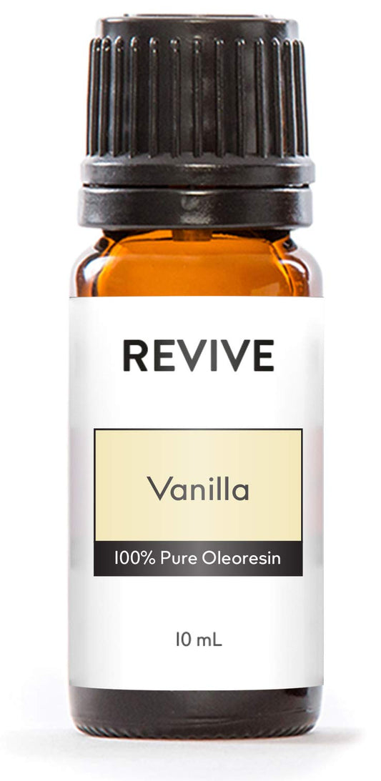 Vanilla essential oil bottle with vanilla beans