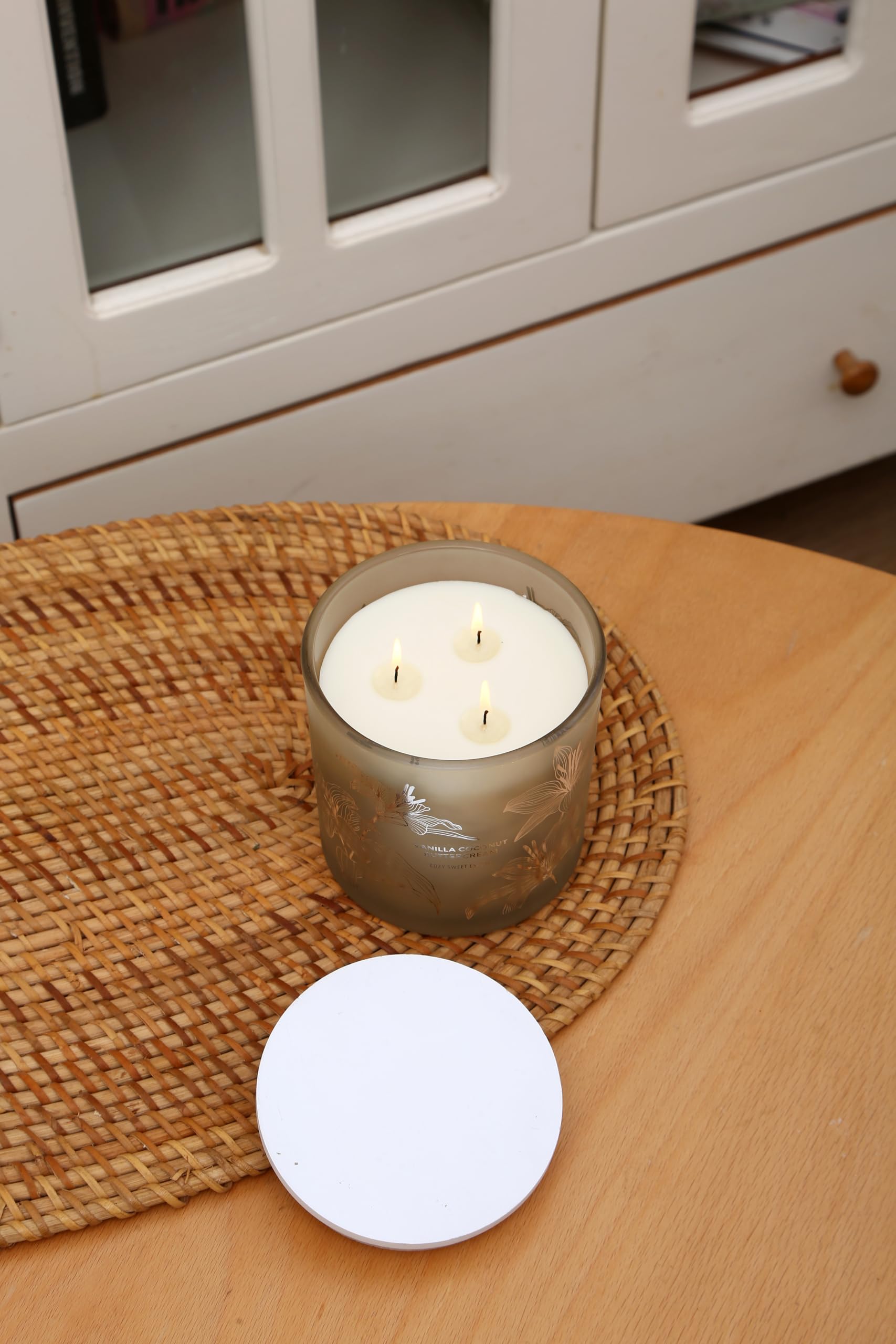 Candle in a cozy room setting