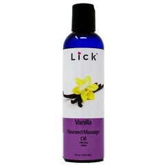 Bottle of vanilla flavored massage oil on spa setting