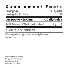 Close-up of VascuStatin Formula capsules poured from bottle