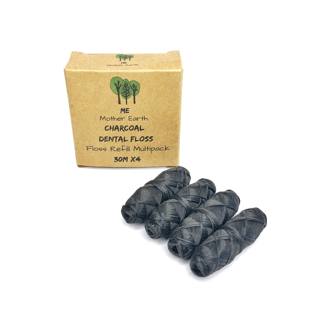 Front view of vegan bamboo charcoal dental floss refill four-pack