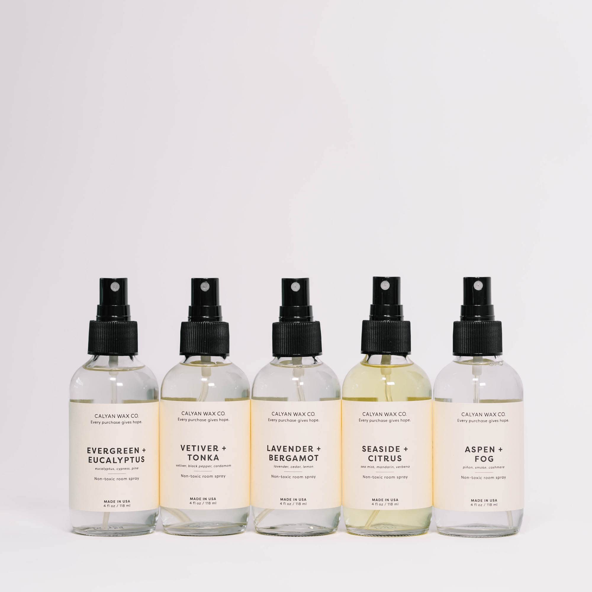 4 fl oz room spray bottle resting on a white surface