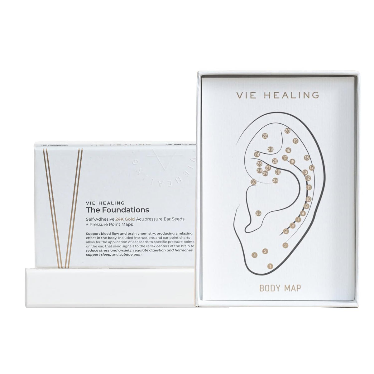 Vie Healing 24K gold ear seeds arranged on a white surface