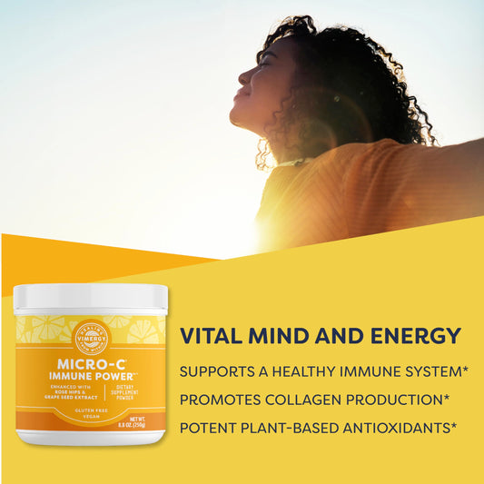 Serving scoop of Vimergy Micro-C Immune Power powder with glass of water