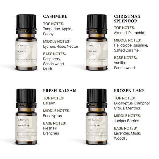 Close-up of various Christmas candle fragrance oil bottles