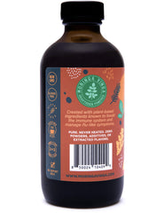 VINGA bottle in hand for scale showing compact 8 oz travel-friendly size