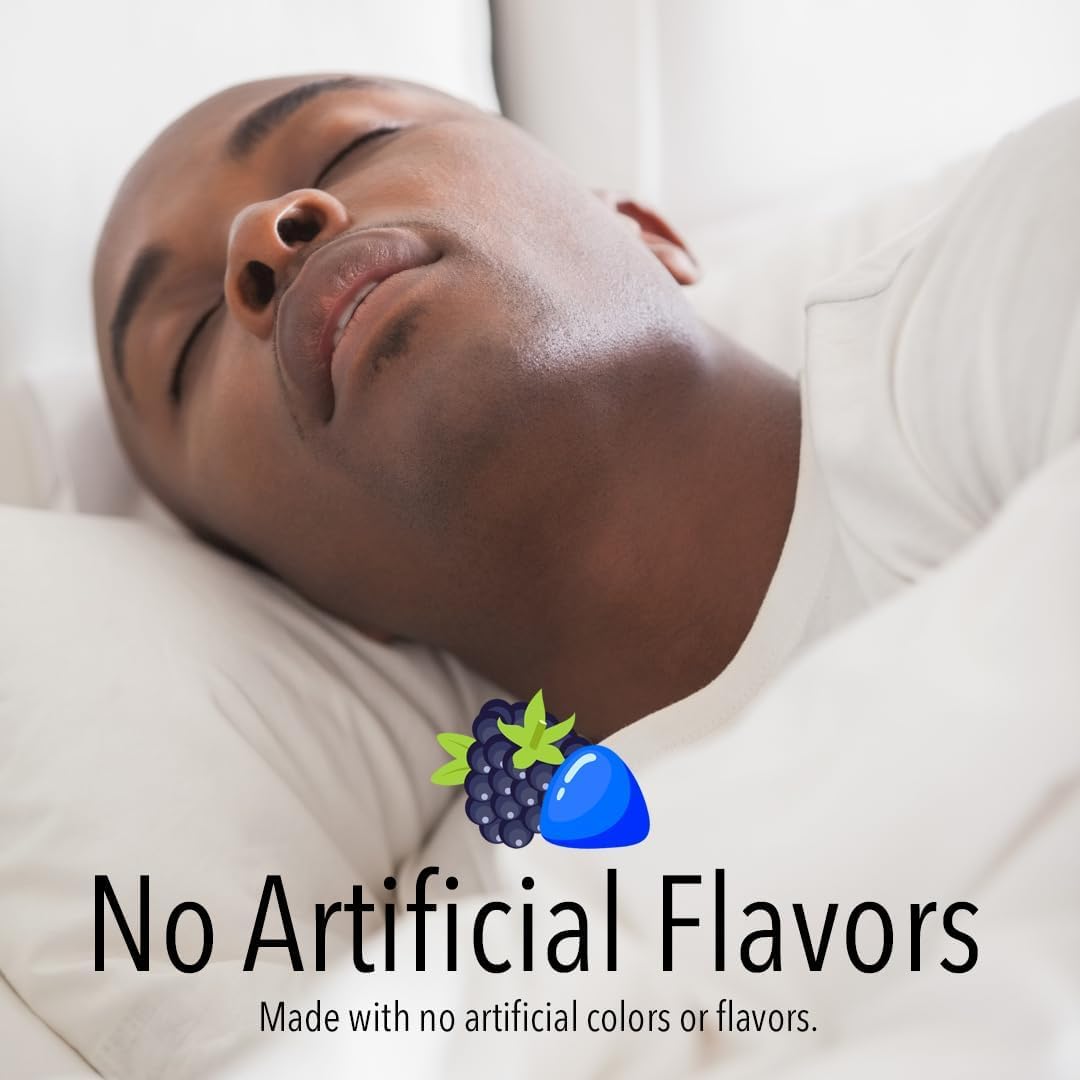 One berry-flavored melatonin gummy close-up