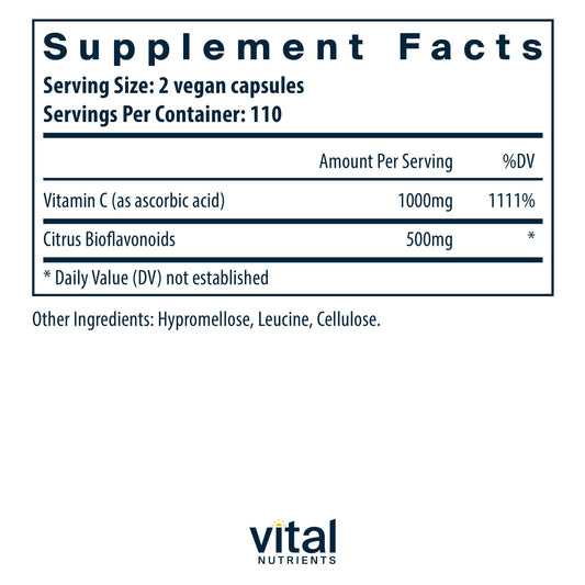 Capsules spilling from Vital Nutrients Vitamin C with Bioflavonoids bottle