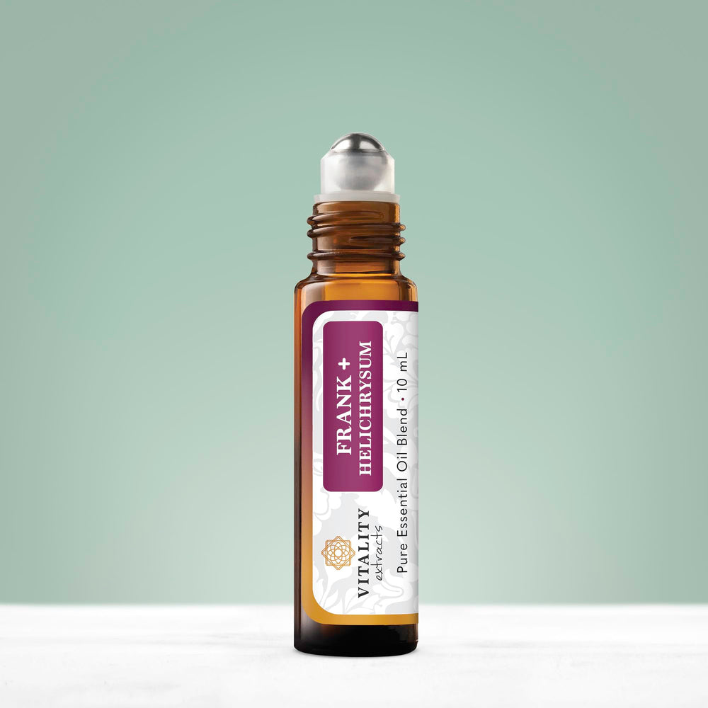 Close-up of Frank+ Helichrysum blend rollerball with bottle