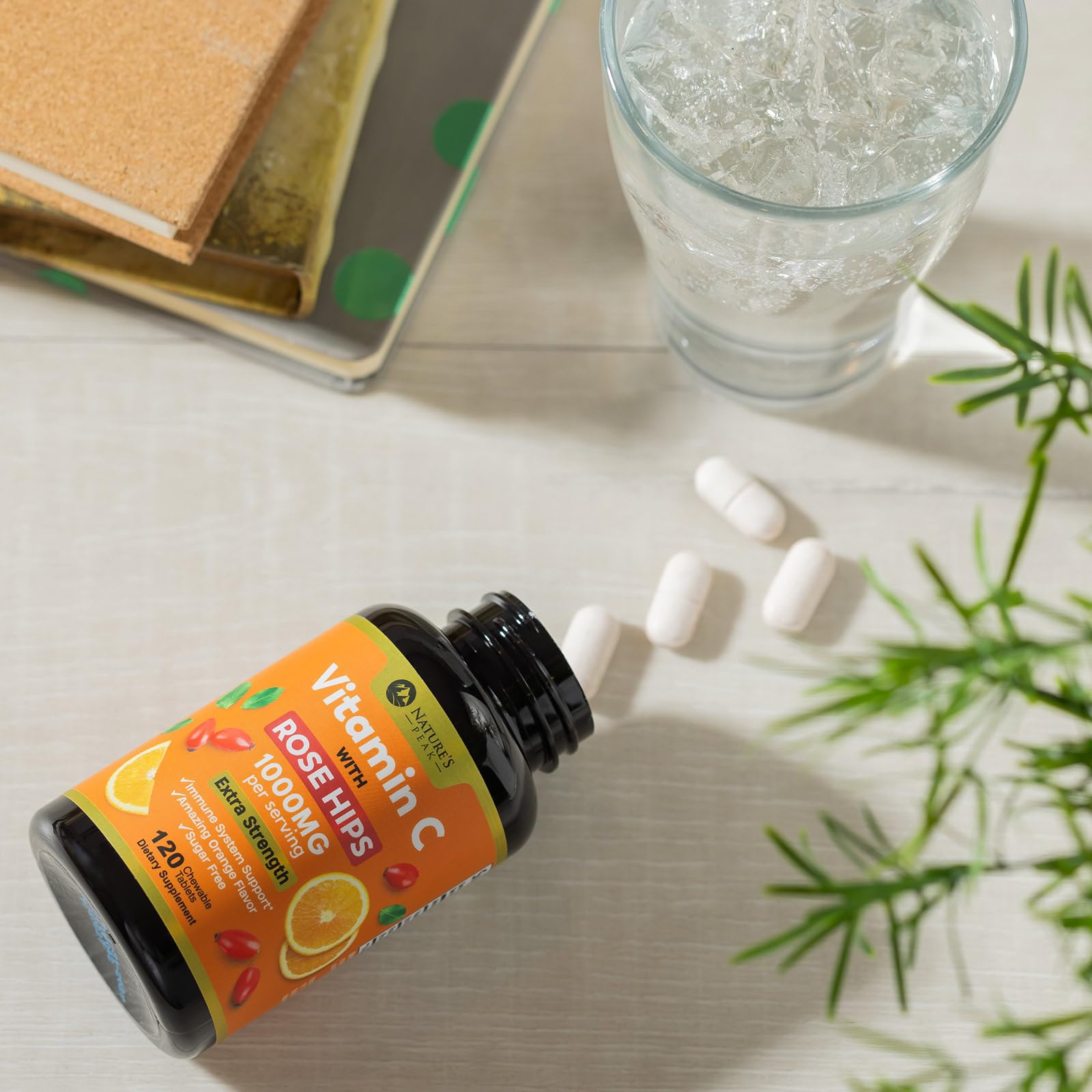 Lifestyle shot with Vitamin C bottle and fresh oranges