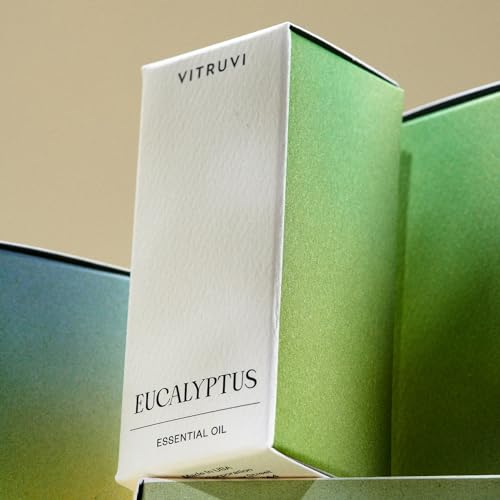 Close-up of Vitruvi Eucalyptus essential oil bottle with dropper