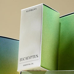 Close-up of Vitruvi Eucalyptus essential oil bottle with dropper