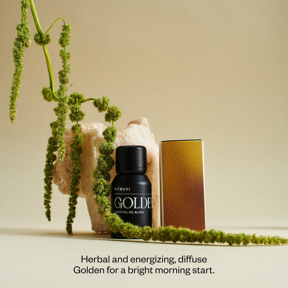Close-up of Vitruvi Golden citrus oil bottle