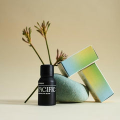 Close-up of Pacific Balance bottle showing essential oil ingredients: Amyris, Bergamot, Eucalyptus, Lavender, Basil