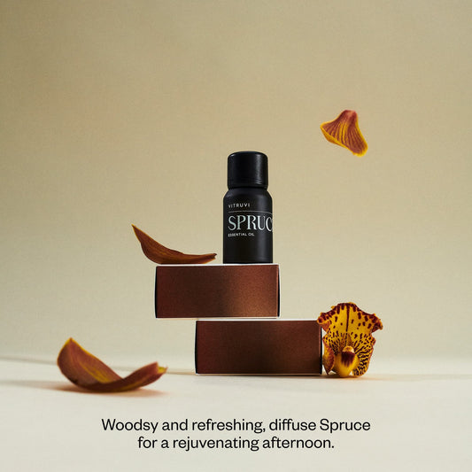 Vitruvi Spruce essential oil bottle side view