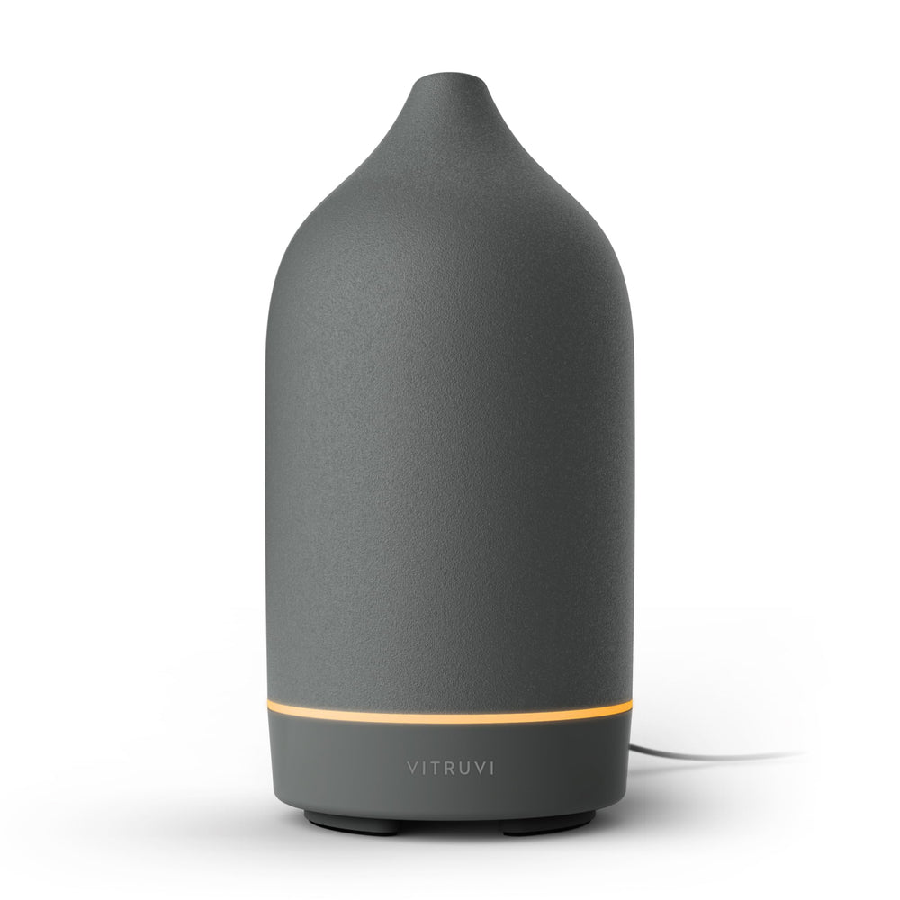 Vitruvi Stone Ceramic Ultrasonic Diffuser on a bedside table