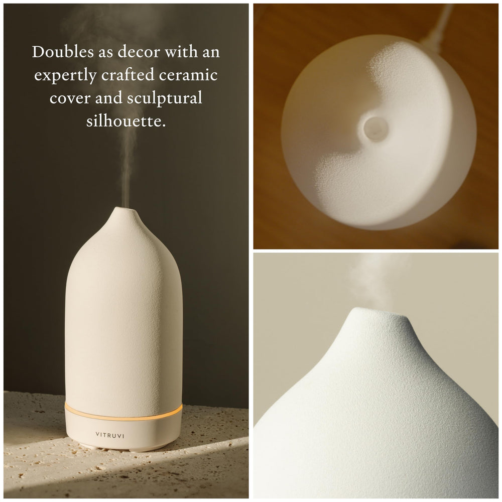 Ultrasonic essential oil diffuser emitting mist in a modern space