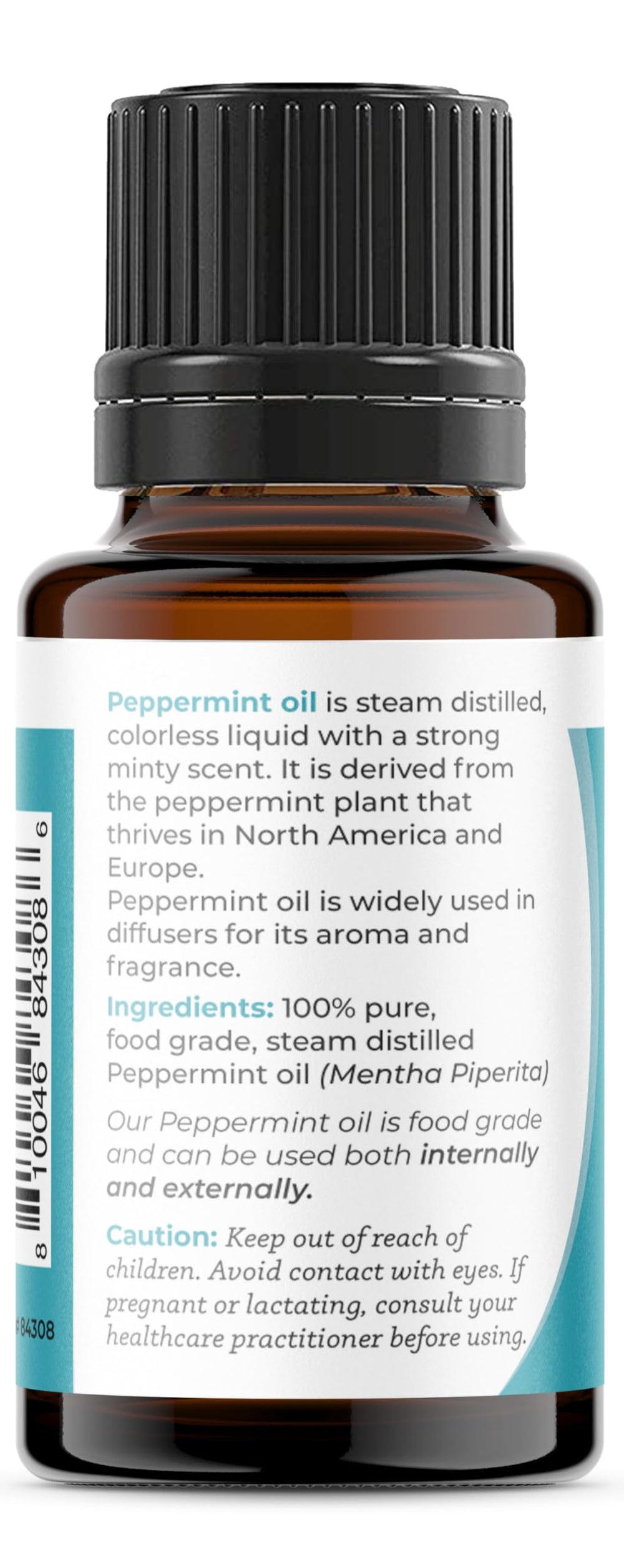 Close-up of peppermint essential oil in glass bottle