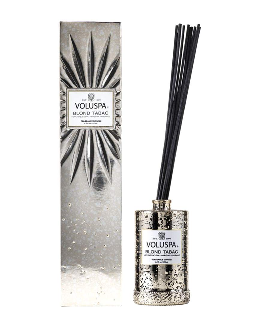 Voluspa Blond Tabac reed diffuser bottle with reeds delivering long-lasting fragrance for living spaces