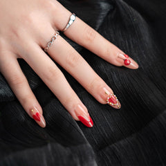 Vopintpy nails feature gold star shine and pearl accents for a glam date-night look