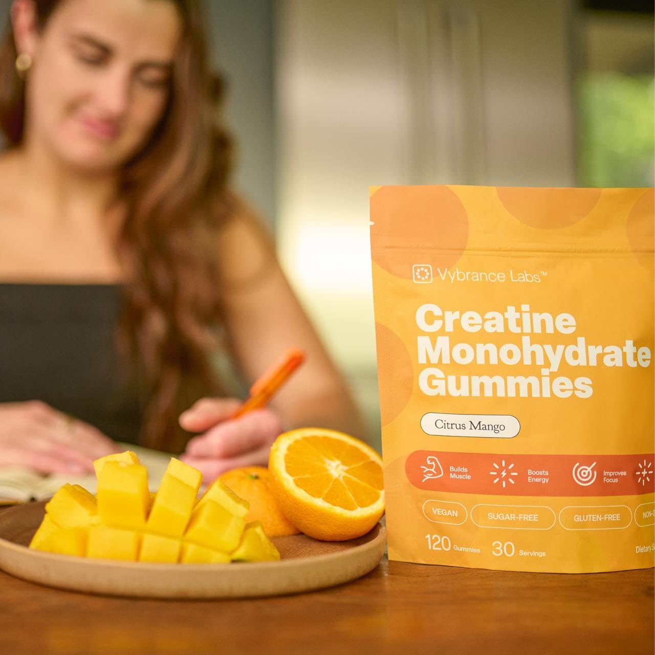 VYBRANCE LABS Creapure Gummies citrus mango flavor close-up with vibrant color.