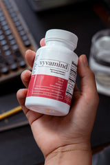 Vyvamind bottle beside a coffee cup signaling balanced energy