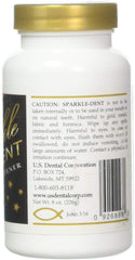 Close-up of dentures soaking with Sparkle Dent cleaner tablet