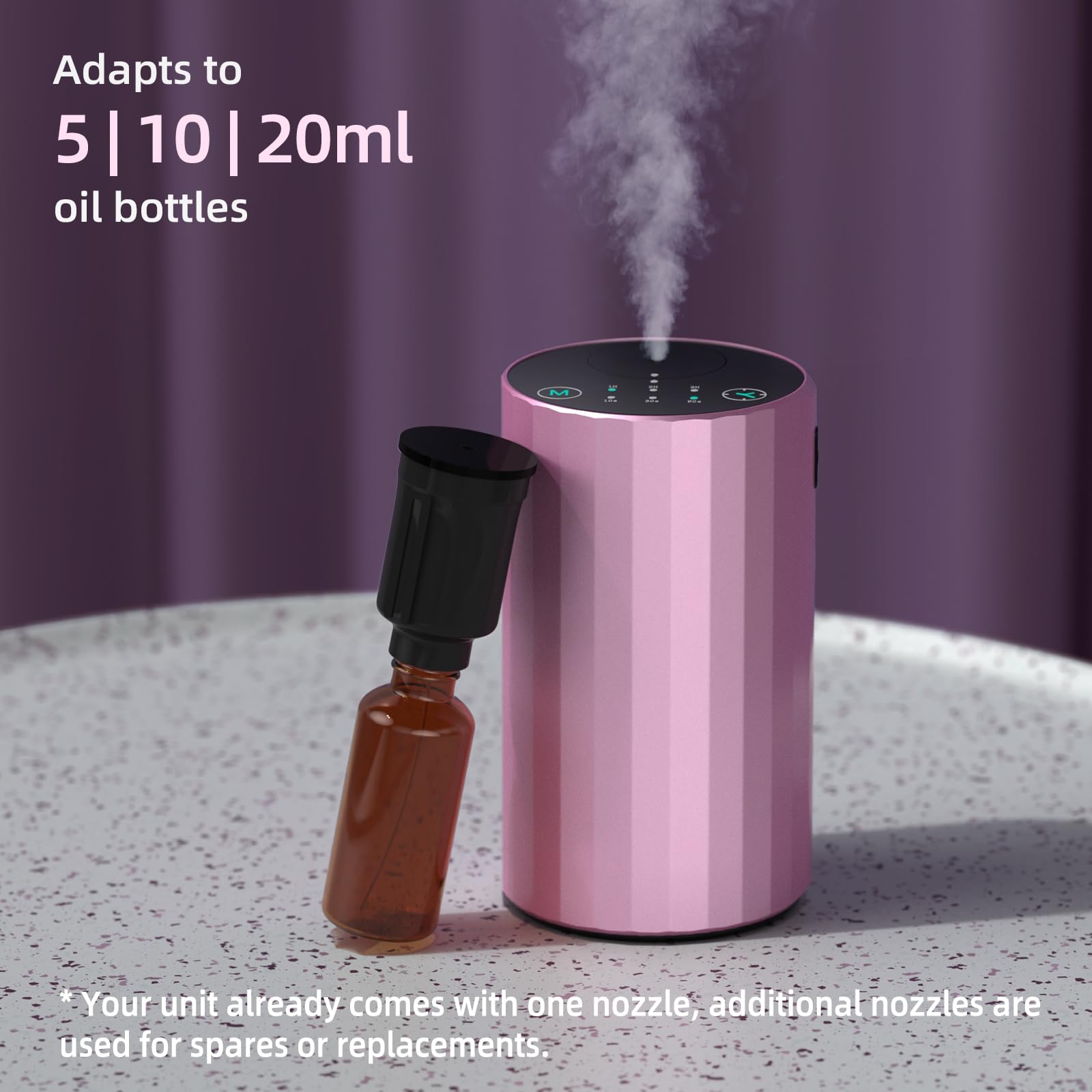 Pink waterless diffuser on office desk