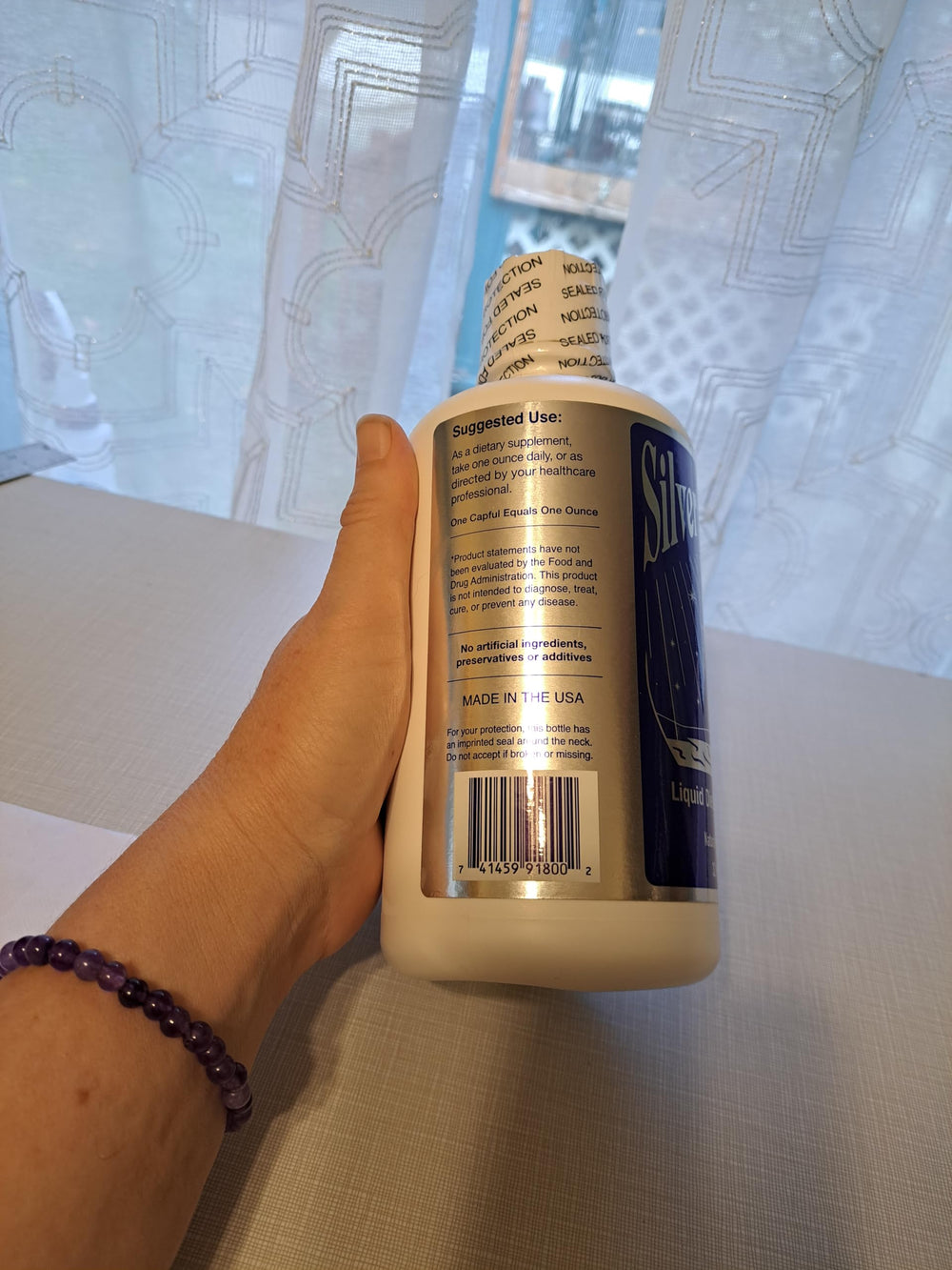 Packaging showing six-pack of Wayne Rowland Silver Water Original Formula