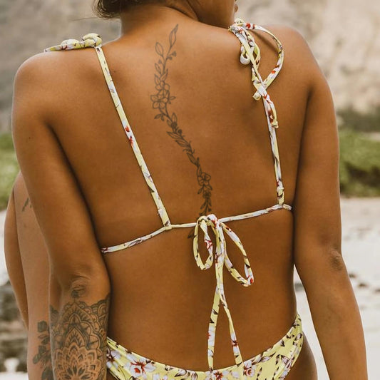 Weekink Floral Vine sleeve wrap tattoo offers a graceful arm accent.