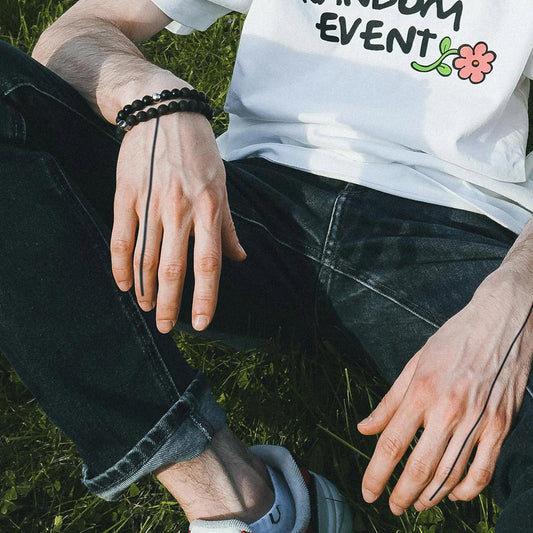 WEEKINK fine line tattoo on finger for delicate accessory look