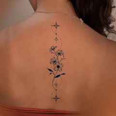 Weekink Spine Flower Tattoo vertical design along the spine for elegant balance.