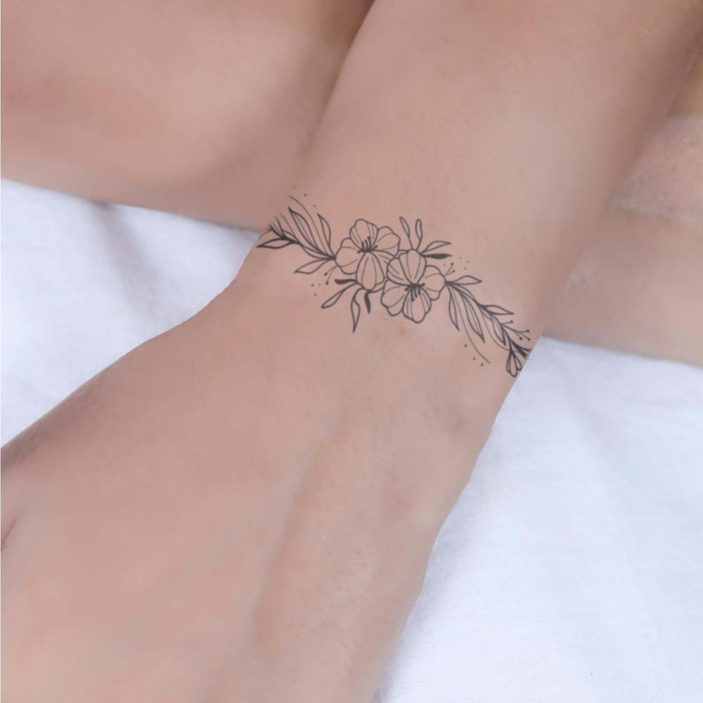 WEEKINK Vine Flowers wrap tattoo with delicate lines resembling real artistry