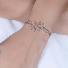 WEEKINK Vine Flowers wrap tattoo with delicate lines resembling real artistry