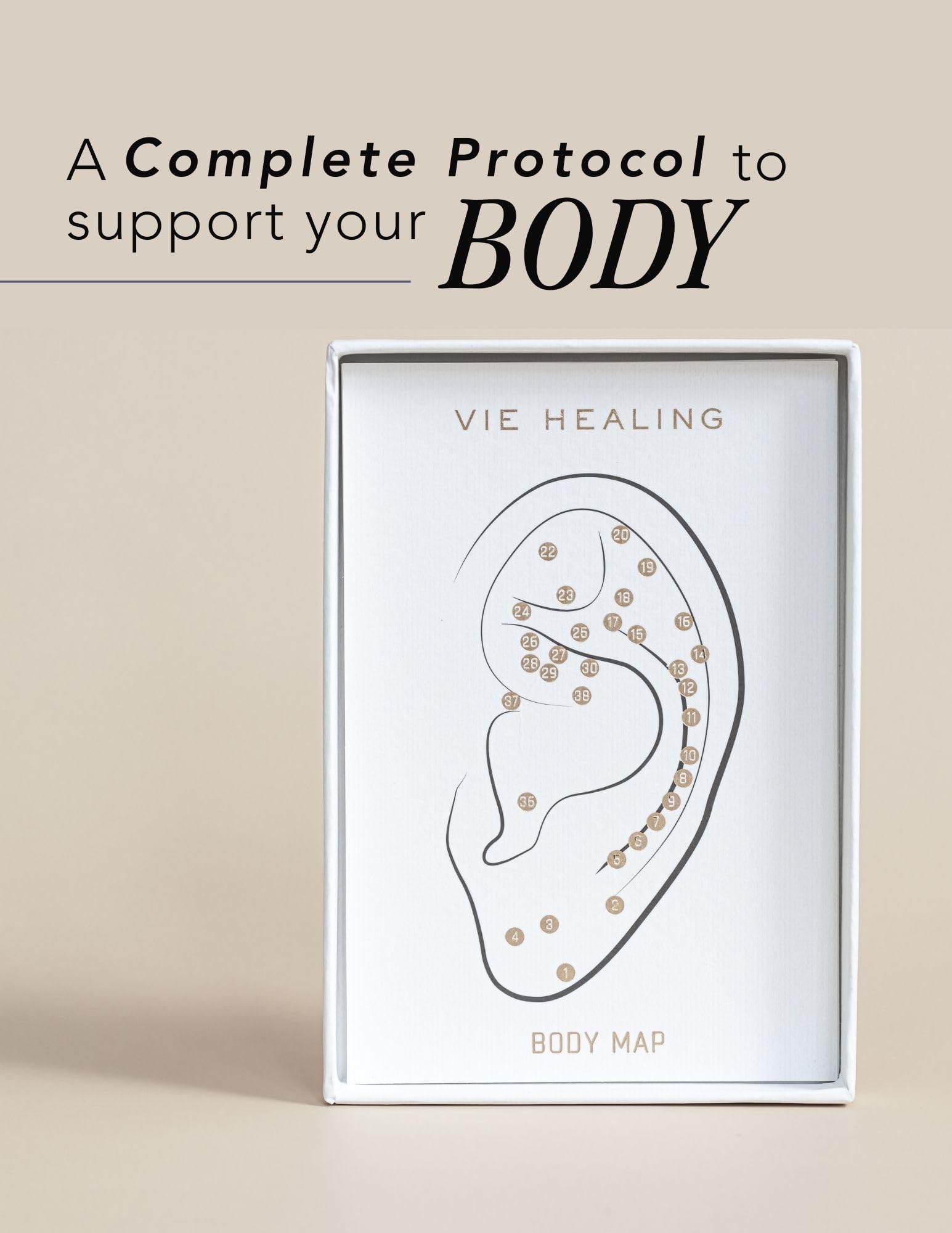 Elegant wellness aesthetic featuring gold ear seeds