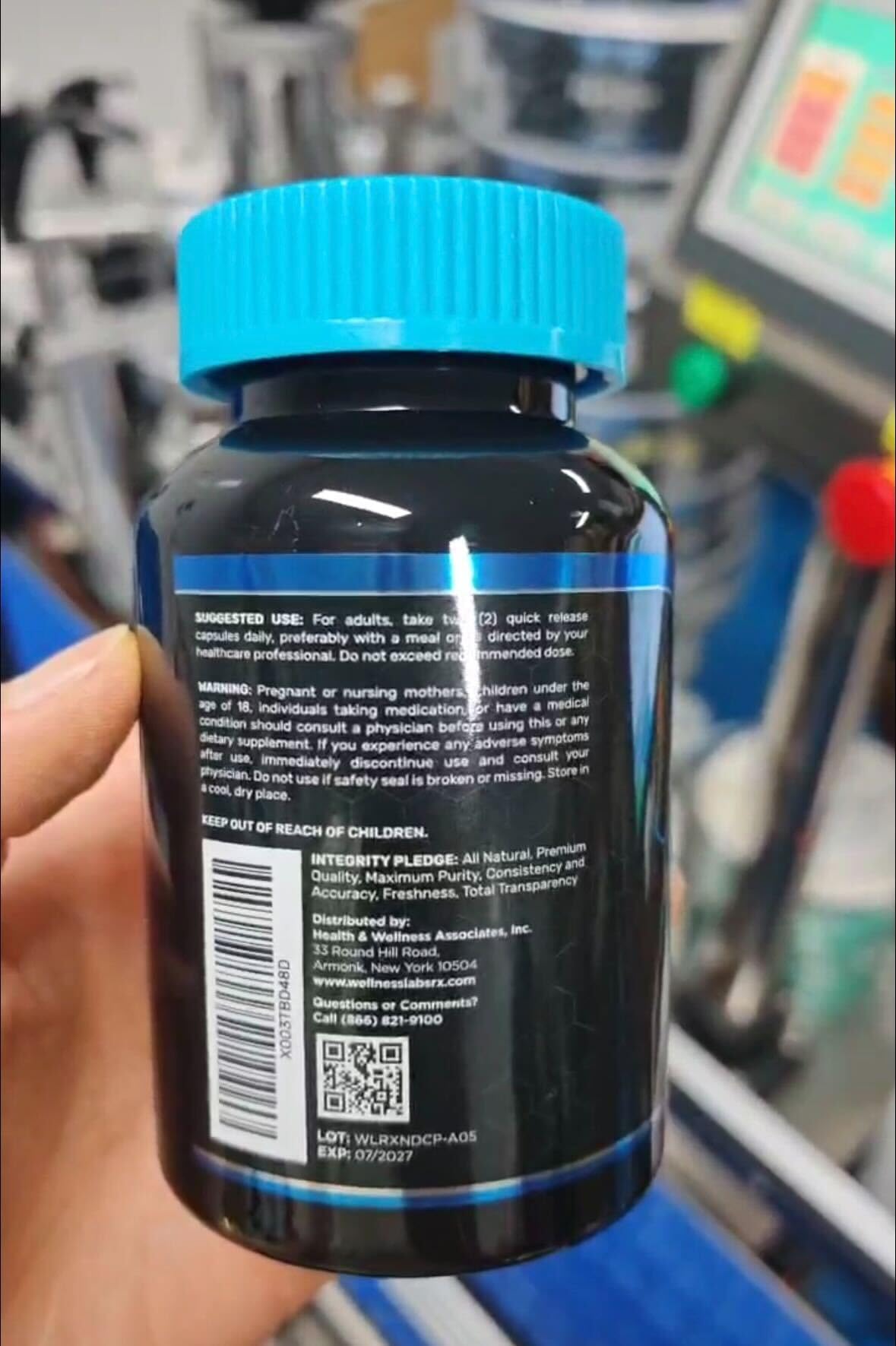 WELLNESS LABSRX liposomal NAD bottle pour demonstrates easy daily dosing for vitality.