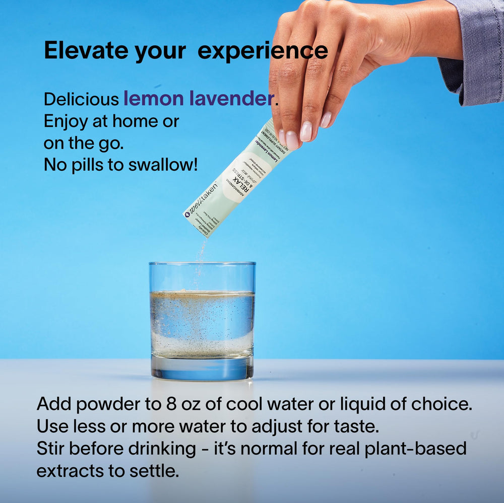 Glass of water with WellTaken Relax & De-Stress lemon lavender powder being mixed