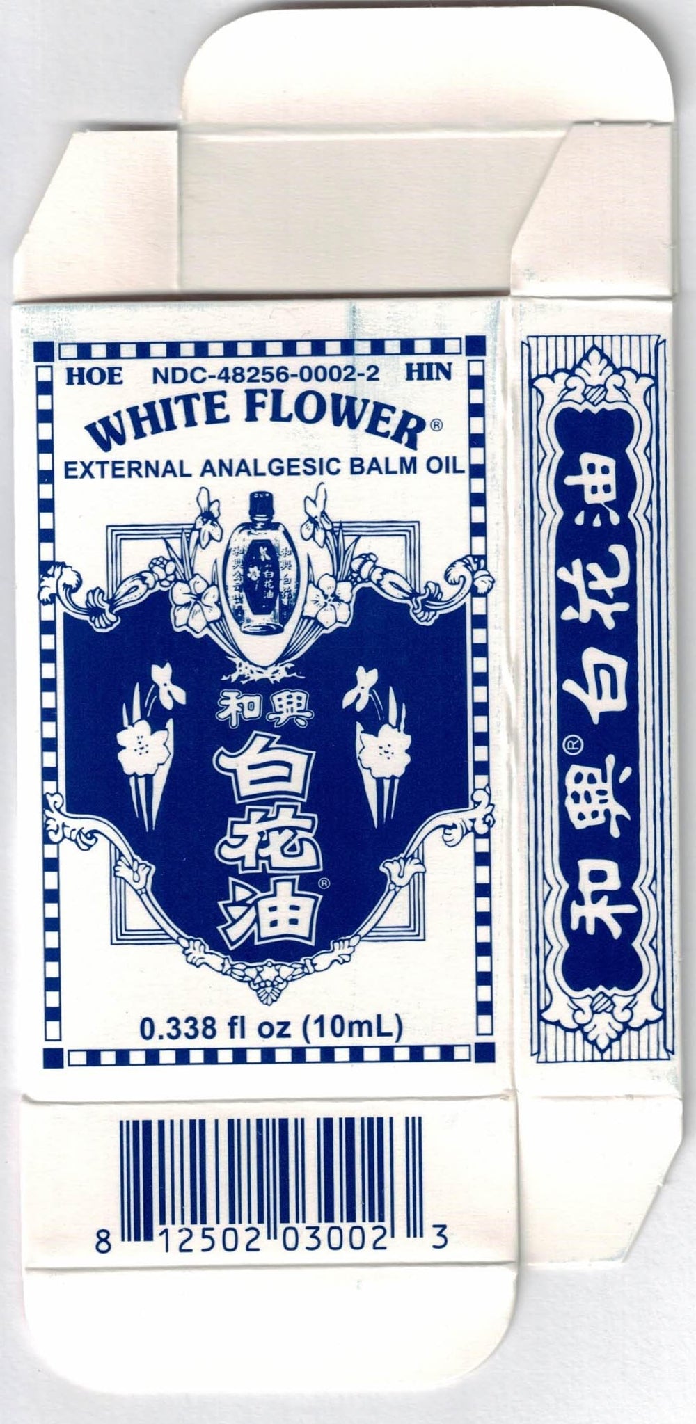 Lifestyle shot of White Flower Balm Oil on a clean surface