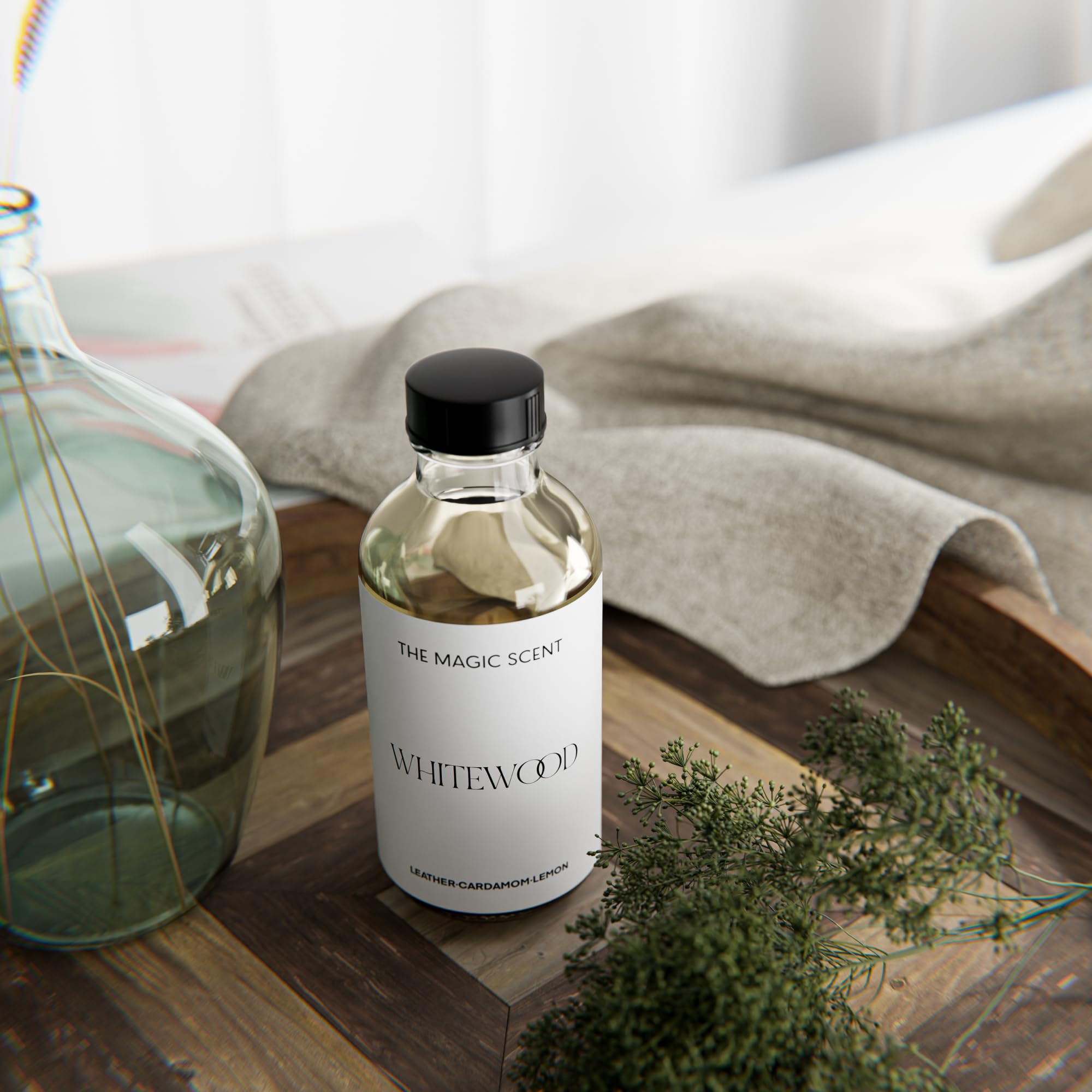 The Magic Scent Whitewood Diffuser Oil bottle atop a diffuser setup.