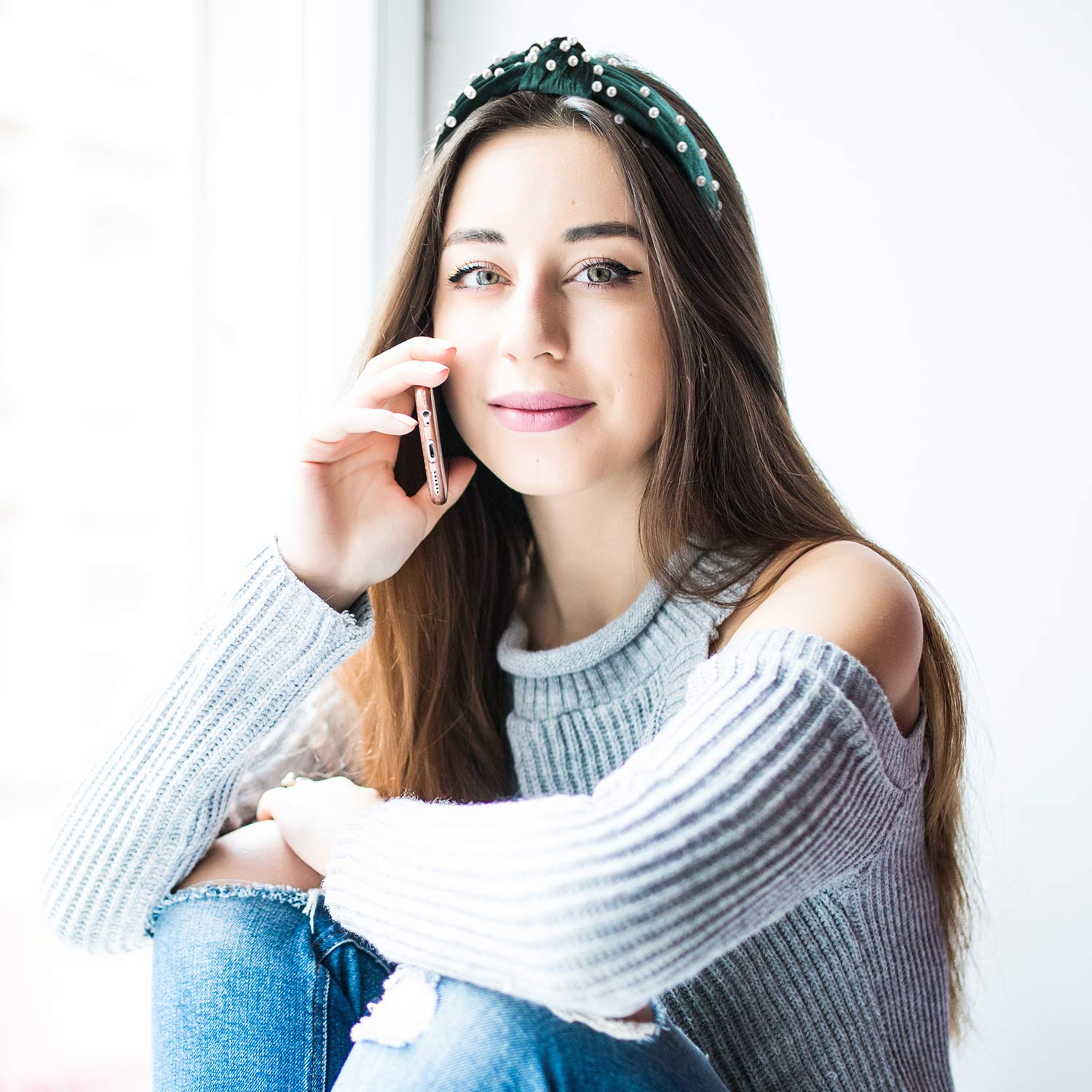Willbond pearl headband worn in hair for a tidy, polished look.