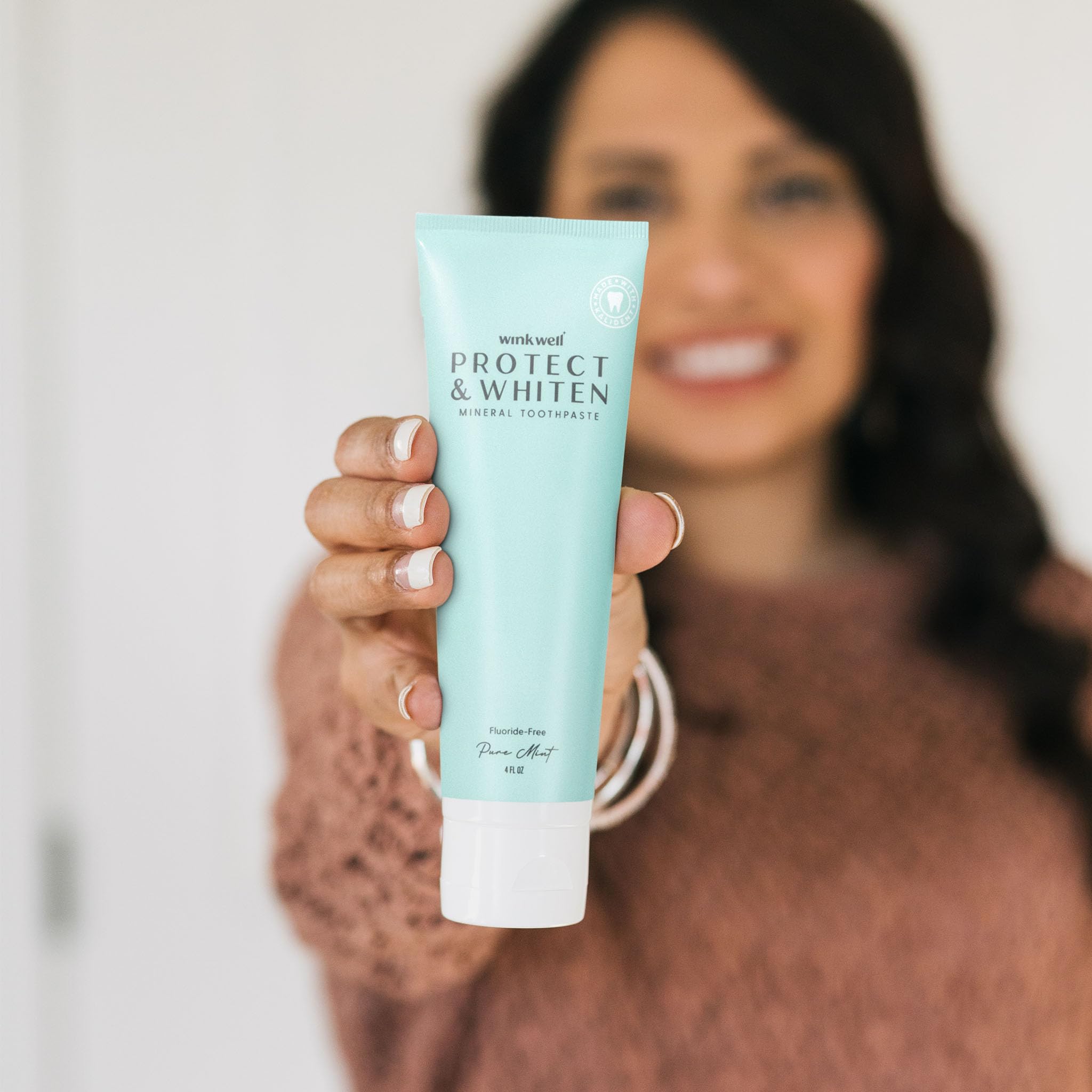 Whole Wink Well toothpaste product with mint leaves and 4 oz tube