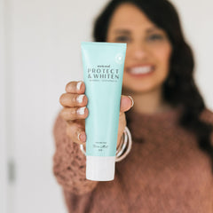 Whole Wink Well toothpaste product with mint leaves and 4 oz tube