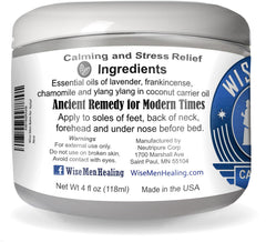 Close-up of Calm Balm ingredients: lavender, frankincense, chamomile and ylang ylang with coconut carrier oil