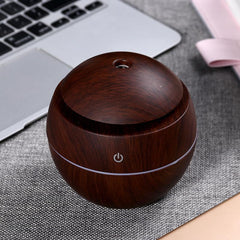 Wood Grain Mushroom Mini Diffuser on a nightstand demonstrates portable aroma diffusion.
