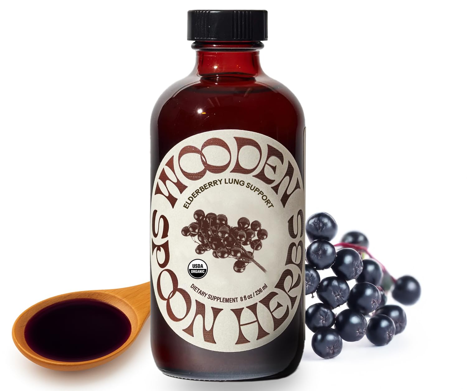 Wooden Spoon Herbs Elderberry Syrup bottle with 8 oz label on a wooden surface