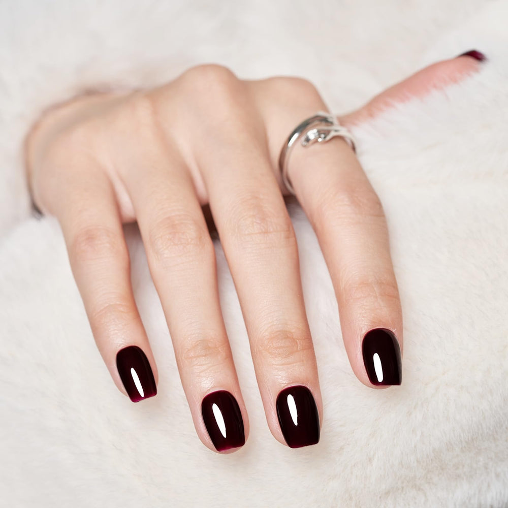 Wooyas dark red press-on nails close-up showing rich color and smooth gel shine