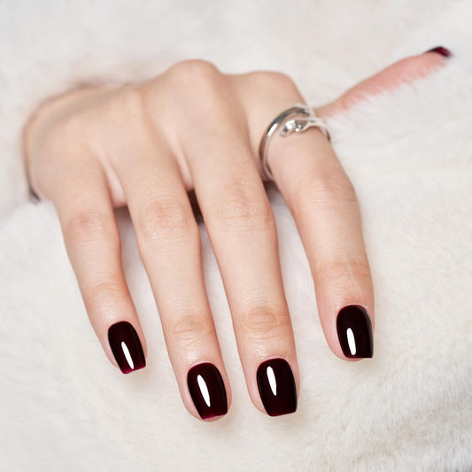 Wooyas dark red press-on nails close-up showing rich color and smooth gel shine