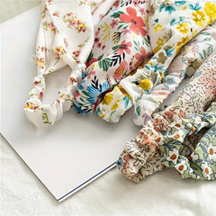 WOVOWOVO floral bandana worn on the wrist as chic accessory
