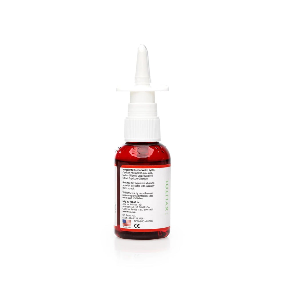 Close-up of Xlear xylitol nasal spray label and bottle detail for all-natural care